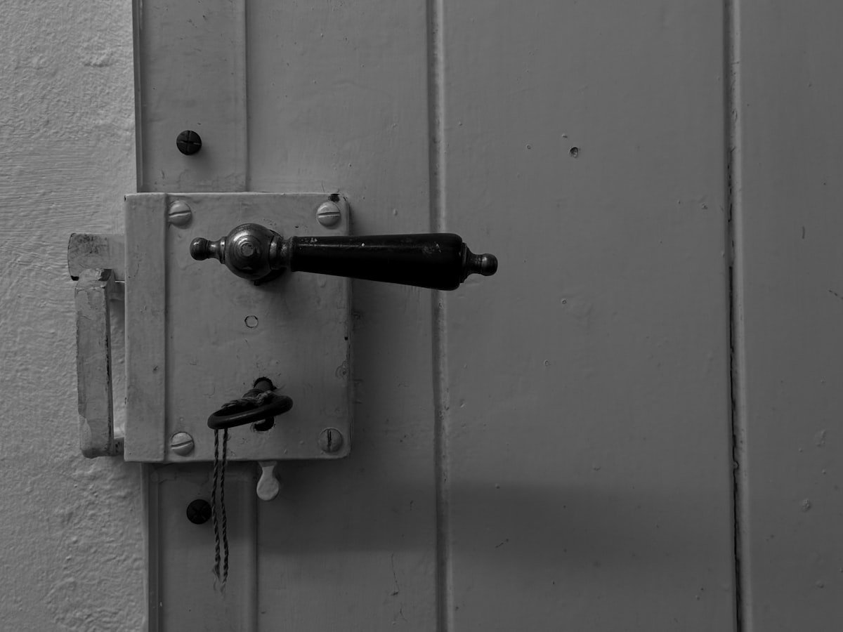 Door handle and lock with key in the keyhole